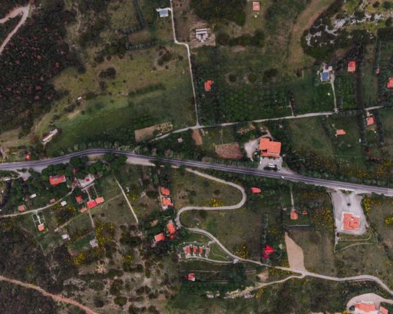 Aerial landscape of rural countryside with road and fields in Delphi, Greece.